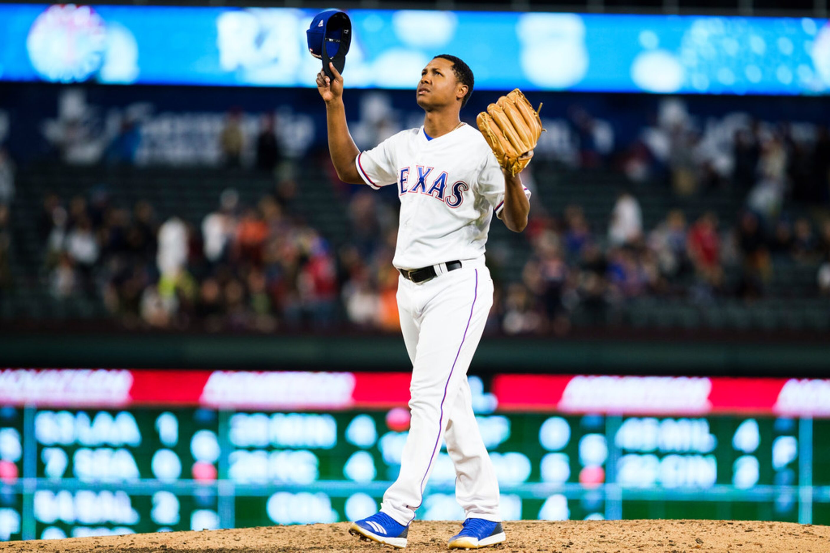 Texas Rangers pitcher Jose Leclerc celebrates after pitching the ninth inning of a 6-4 win...