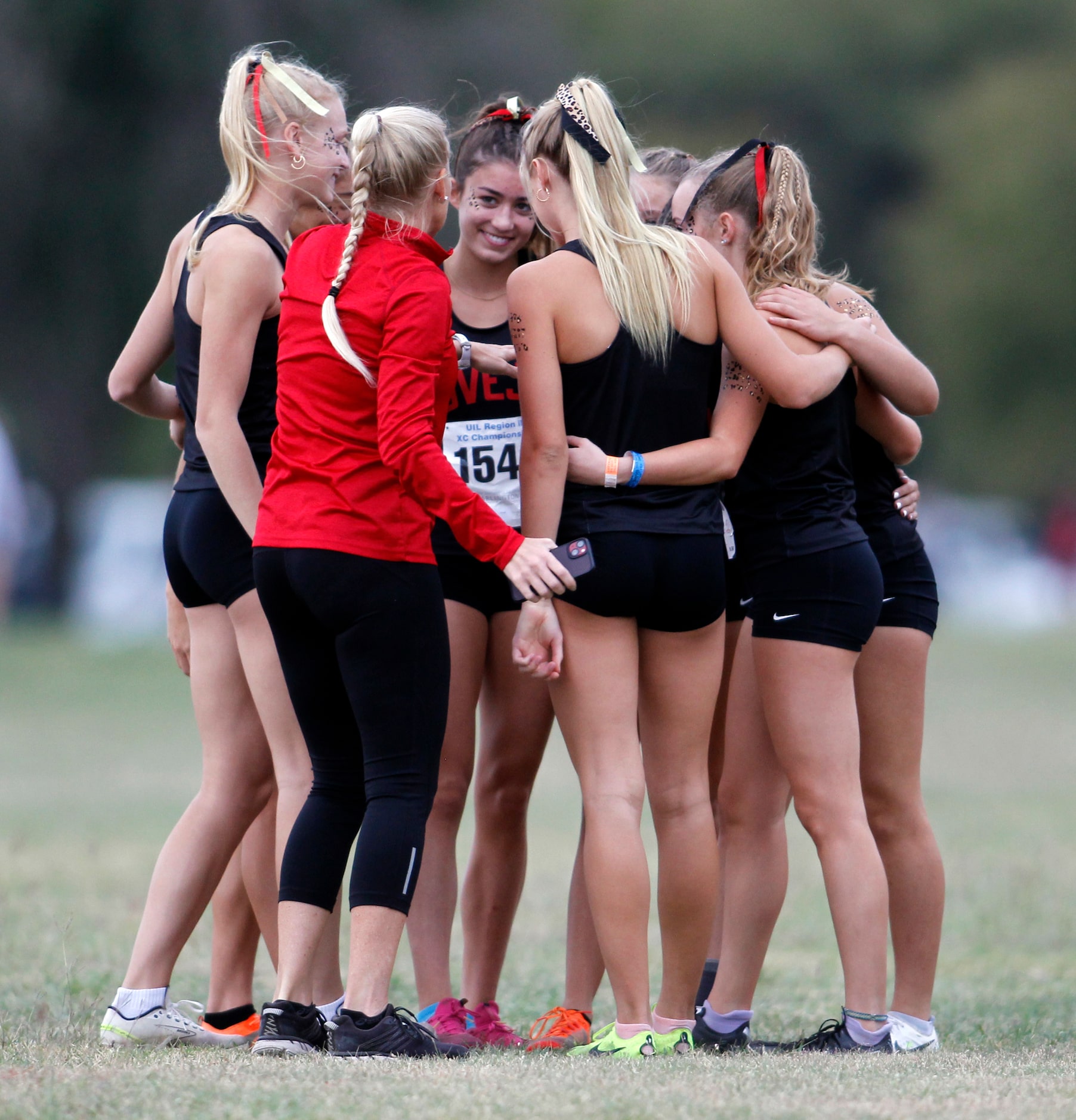 Lucas Lovejoy sophomore Bridget Bernal (background center) sports a smile as girls head...