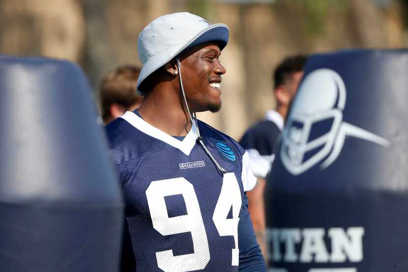 Dallas Cowboys defensive end Randy Gregory smiles during afternoon practice at the training...