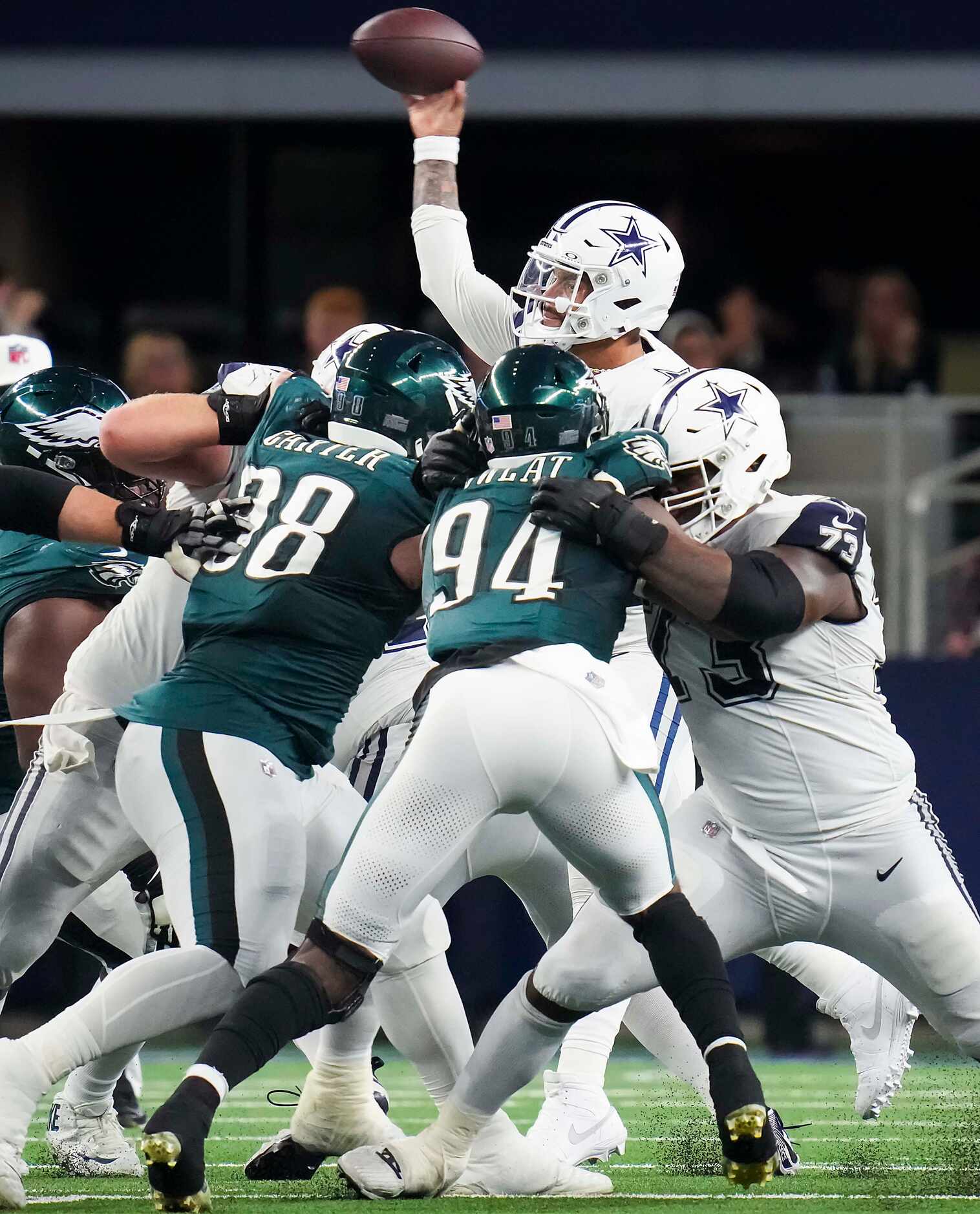 Dallas Cowboys quarterback Dak Prescott (4) gets a block from offensive tackle Tyler Smith...