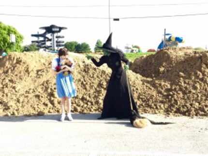  Dorothy and the Wicked Witch of the West watched as 3 million pounds of sand were dropped...