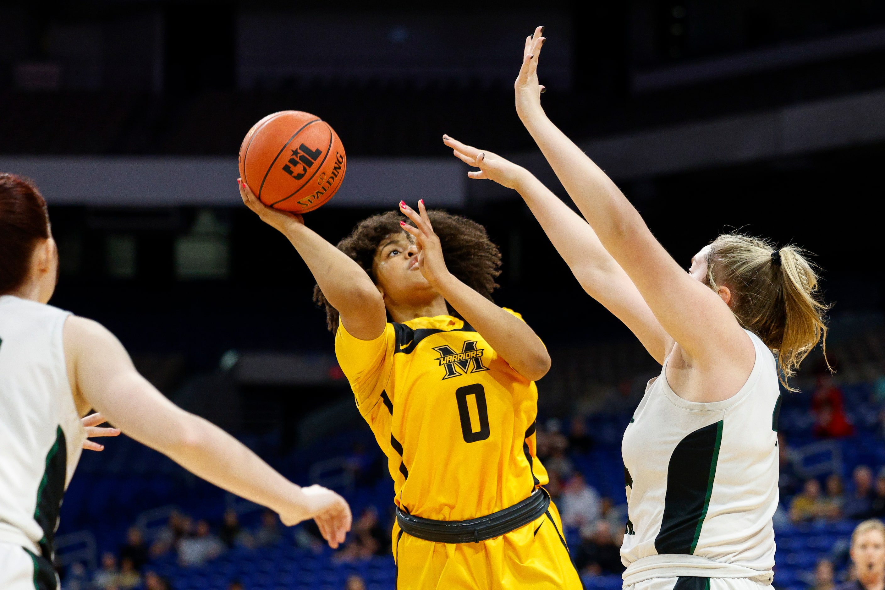 Frisco Memorial guard Brynn Lusby (0) floats a shot over Cedar Park forward Shelby Hayes...