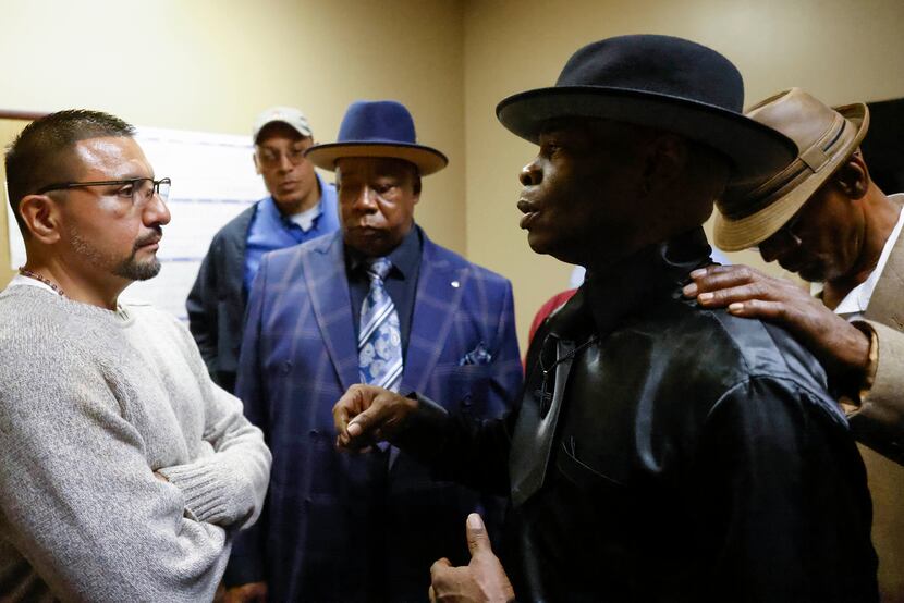From left, Martin Santillan talks with other exonerees, Victor Thomas, Charles Chatman and...