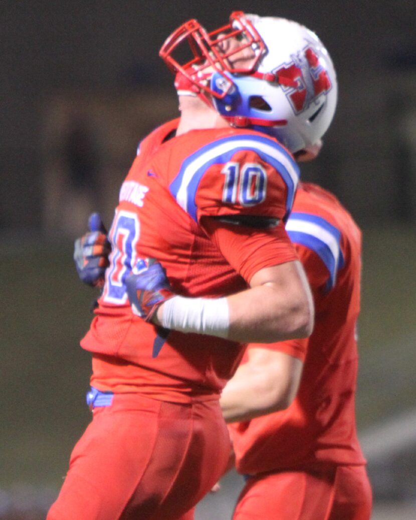 Midlothian Heritage running back Nathan Gaskamp (10) lets out a yell after the Jaguars...