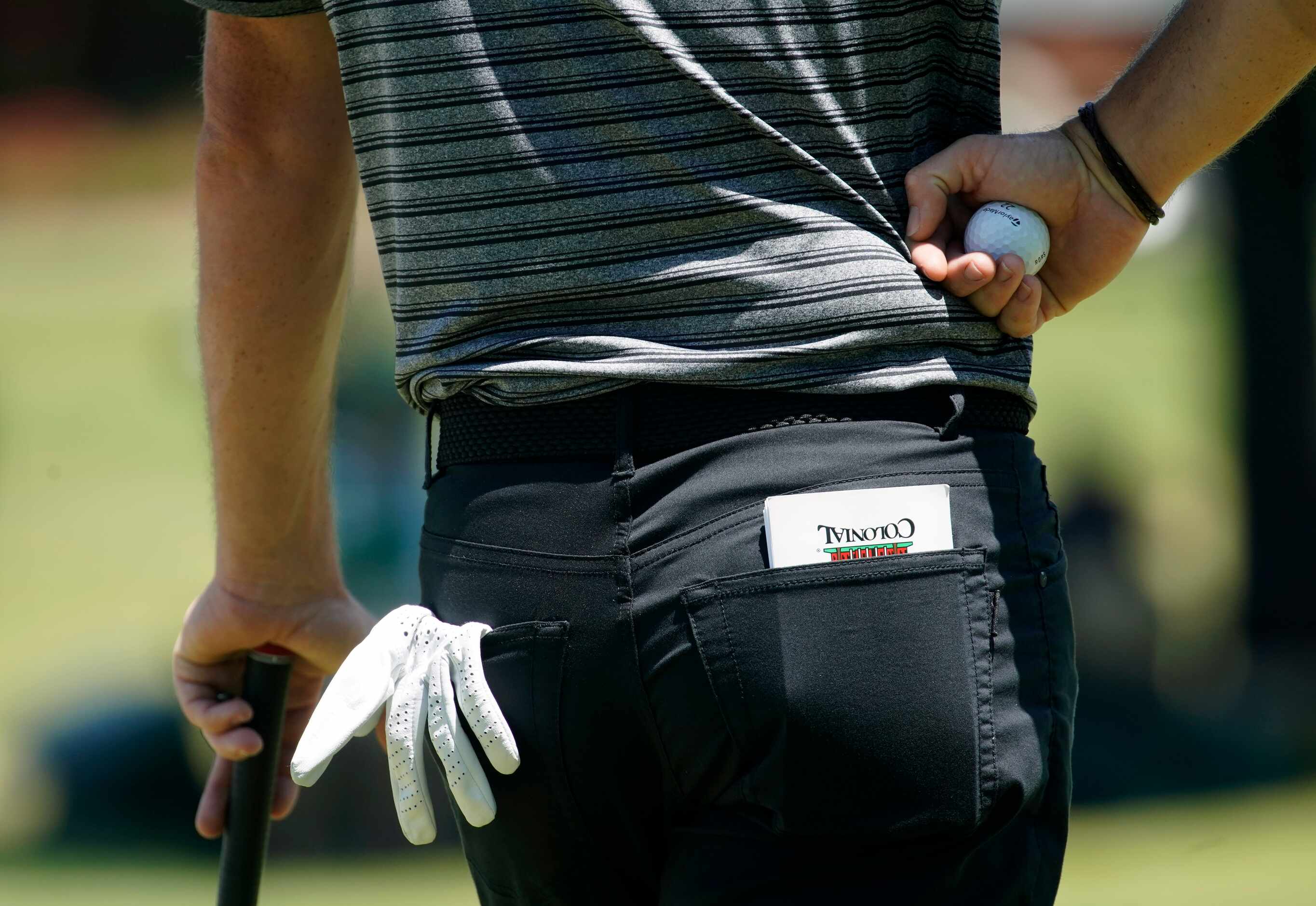 PGA Tour golfer Rory McIlroy kept his notes in a Colonial County Club note book as he waits...