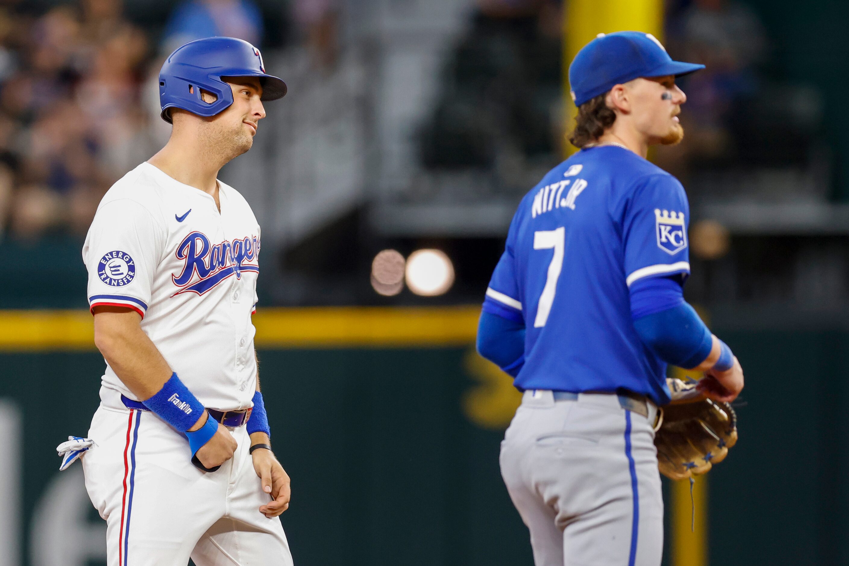 Texas Rangers first baseman Nathaniel Lowe (30) reacts after stealing second base alongside...