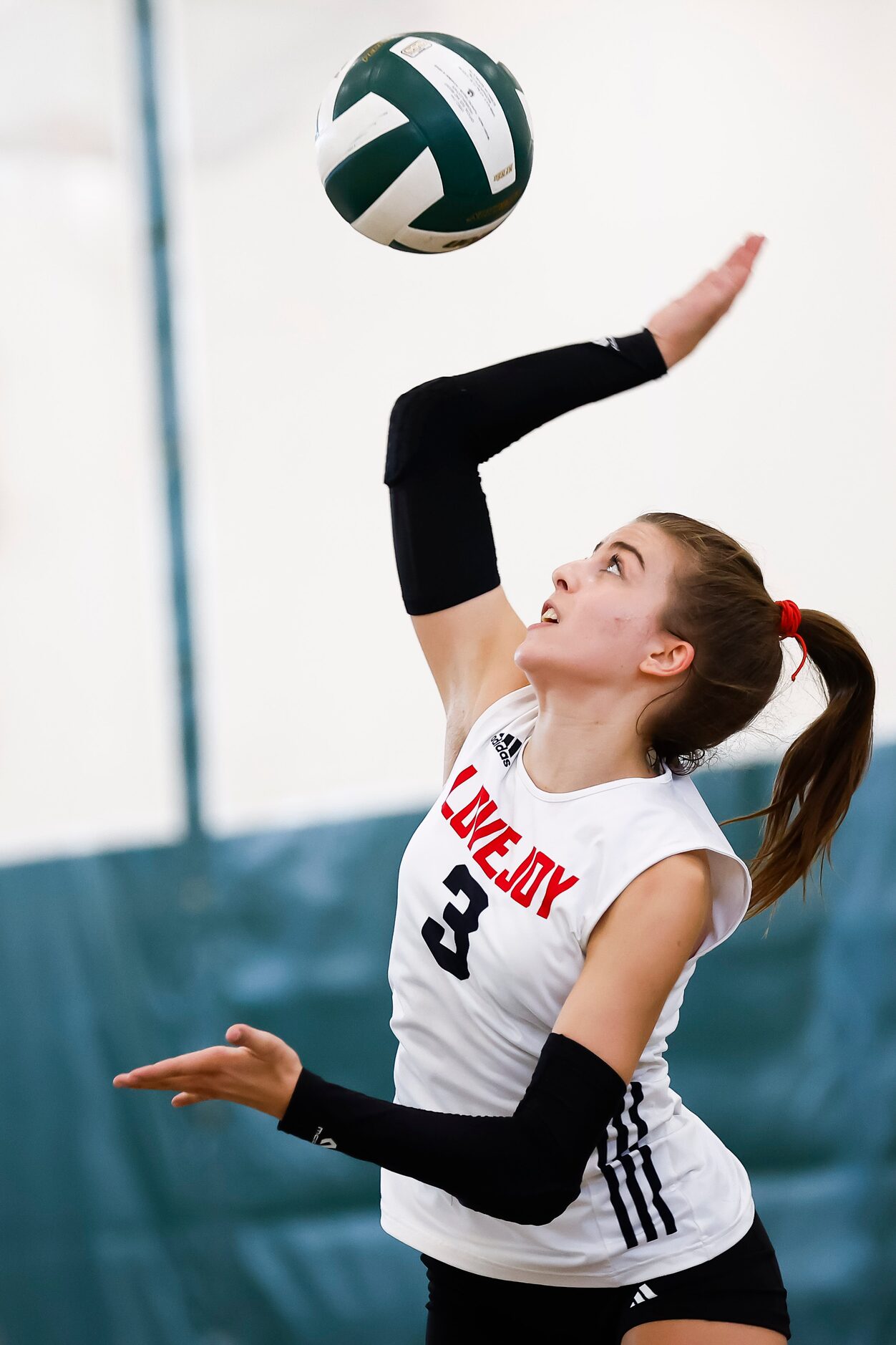 Love Joy senior libero McKenna Brand serves during a high school volleyball match against...