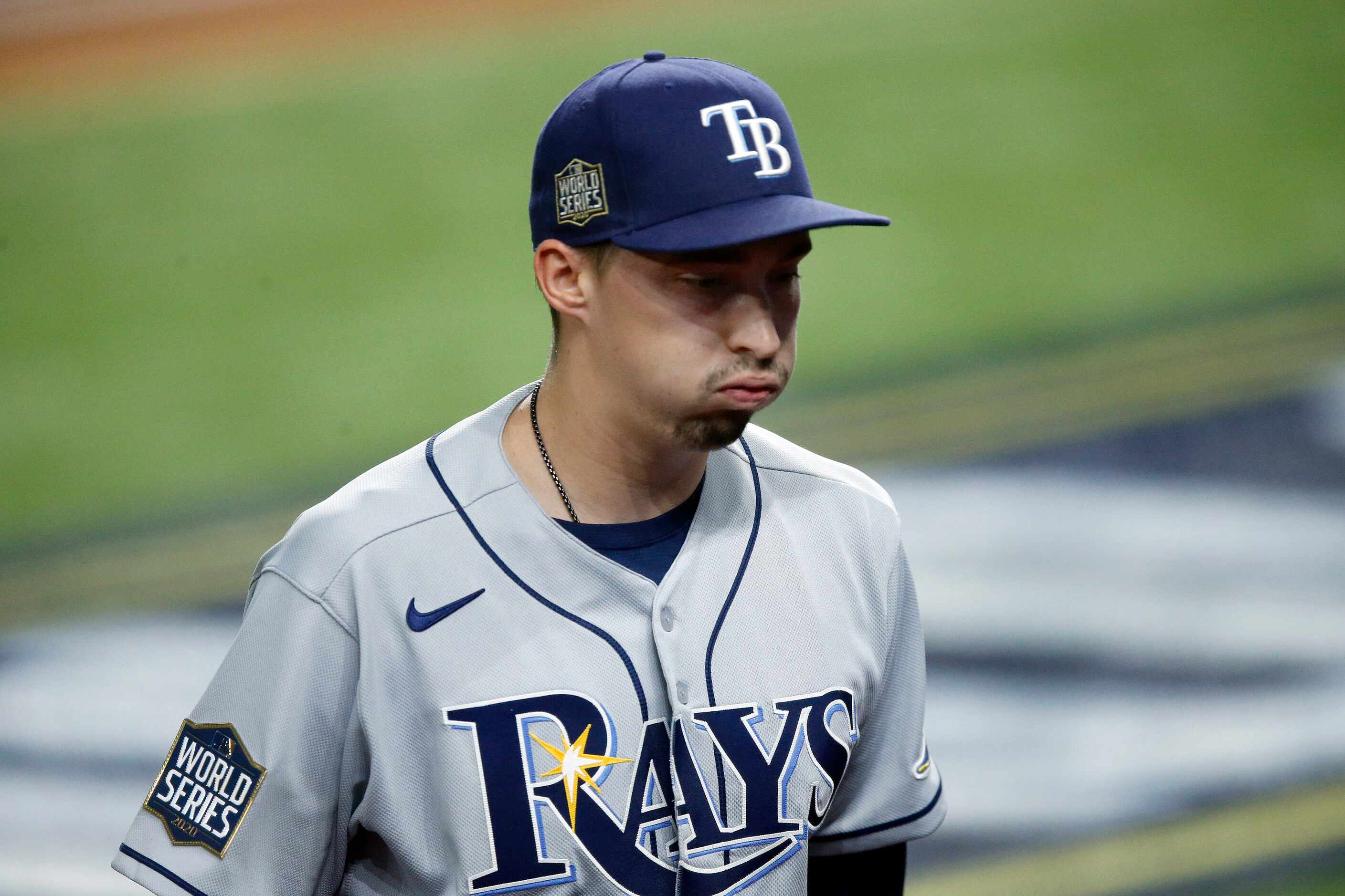 Tampa Bay Rays starting pitcher Blake Snell (4) reacts after retiring the final Los Angeles...