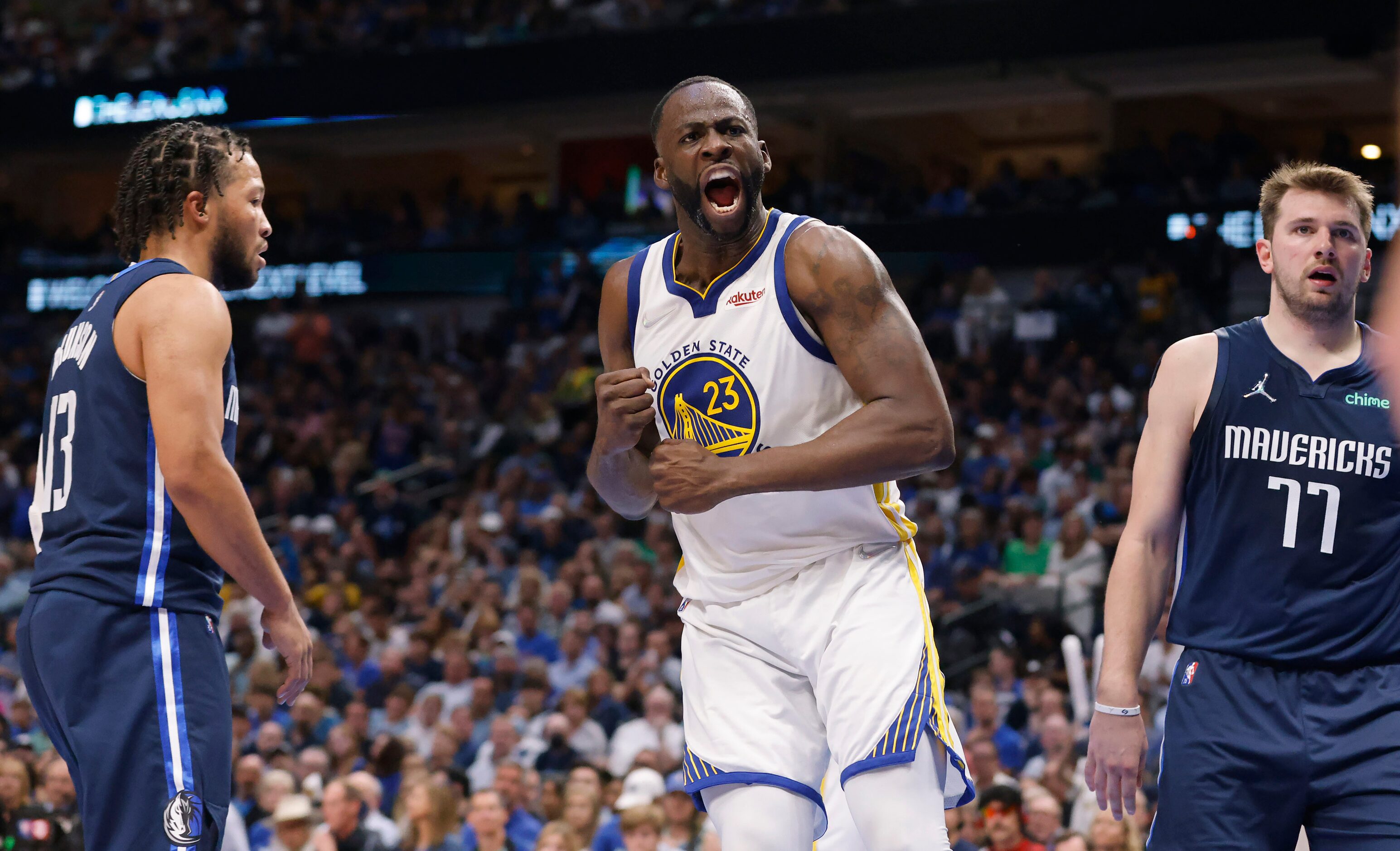 Golden State Warriors forward Draymond Green (23) reacts after driving on Dallas Mavericks...