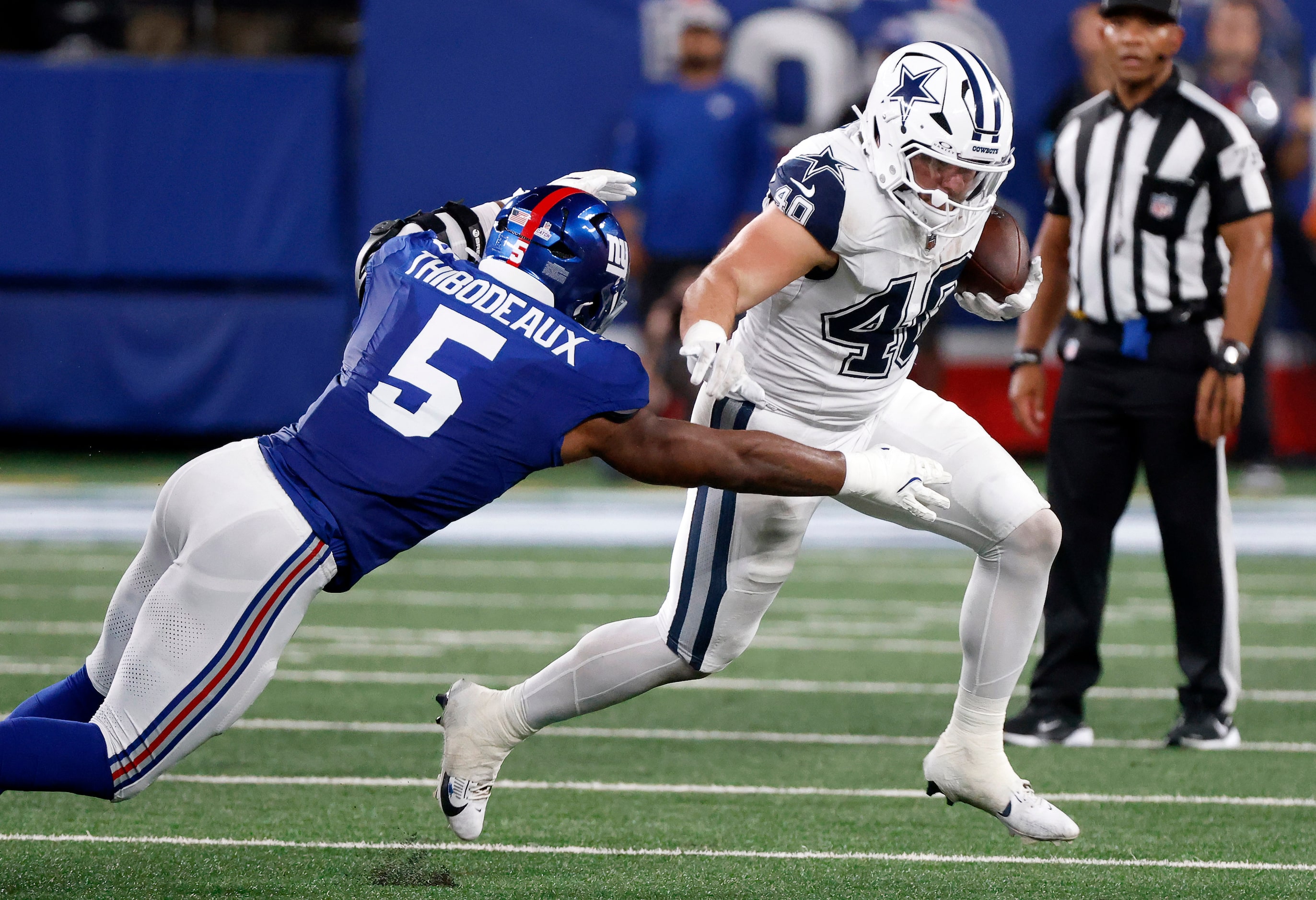 Dallas Cowboys running back Hunter Luepke (40) carries the ball on the first half as he’s...