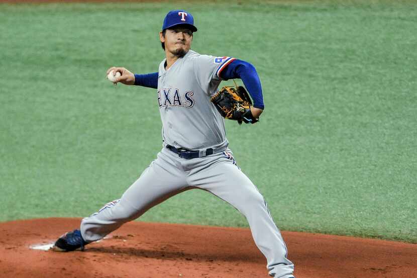 Texas Rangers starter Kohei Arihara pitches to a Tampa Bay Rays batter during the first...