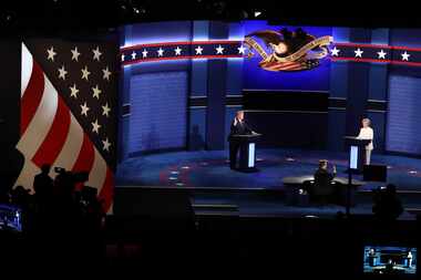 Moderator Chris Wallace, center, gestures as Donald Trump, 2016 Republican presidential...
