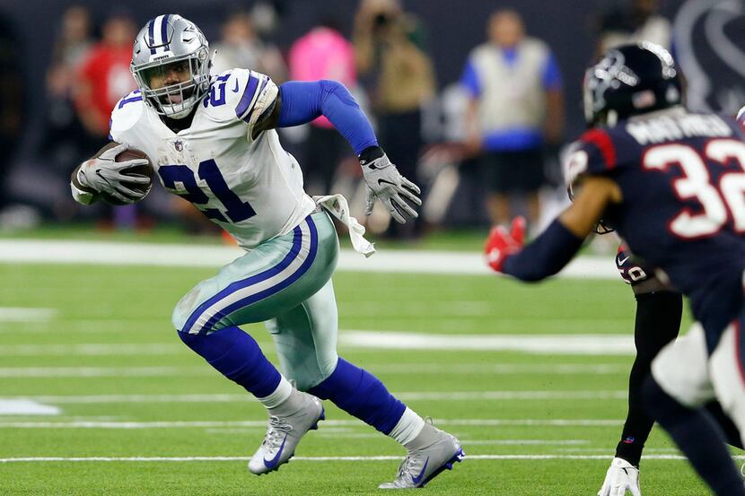 Dallas Cowboys running back Ezekiel Elliott (21) rushes up the field during the second half...