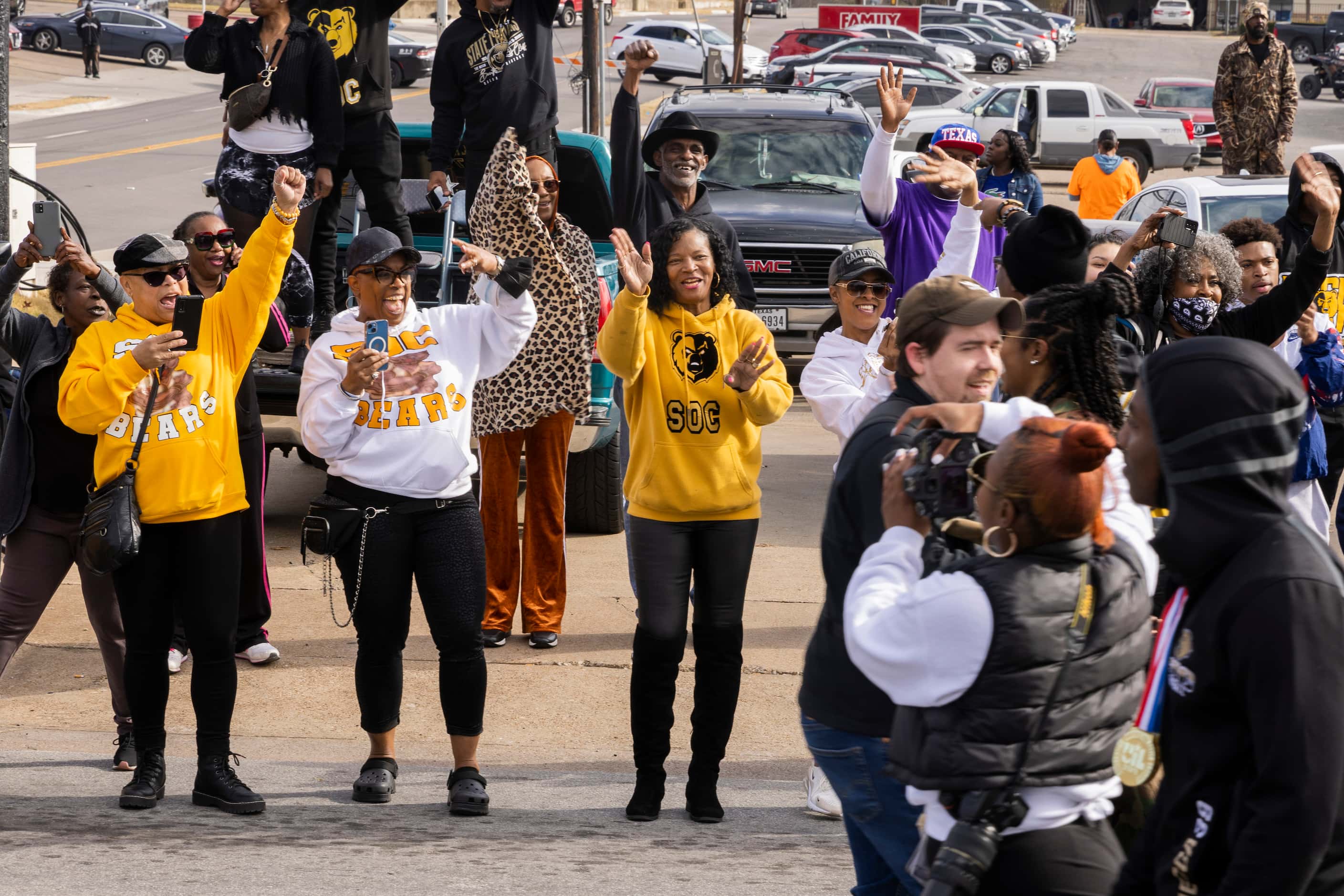 A fans react as the the South Oak Cliff Golden Bears make their way during a parade for...