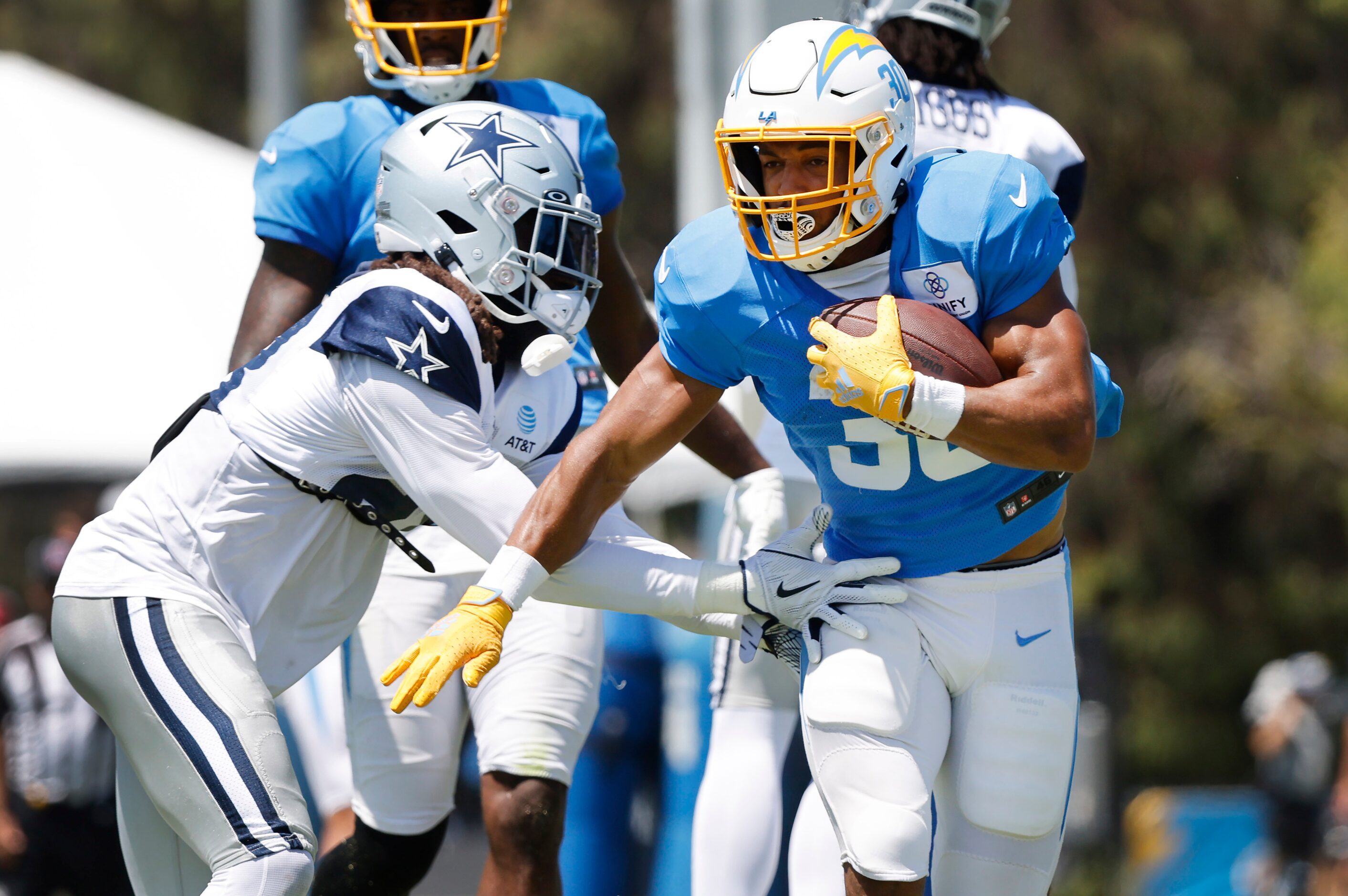 Dallas Cowboys safety Malik Hooker (28) tags Los Angeles Chargers running back Austin Ekeler...