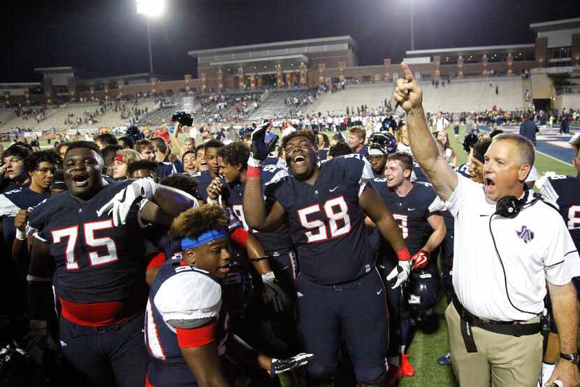 FILE - Allen offensive linemen E.J. Ndoma-Ogar (75) and Tai Brooks (58) celebrate with head...