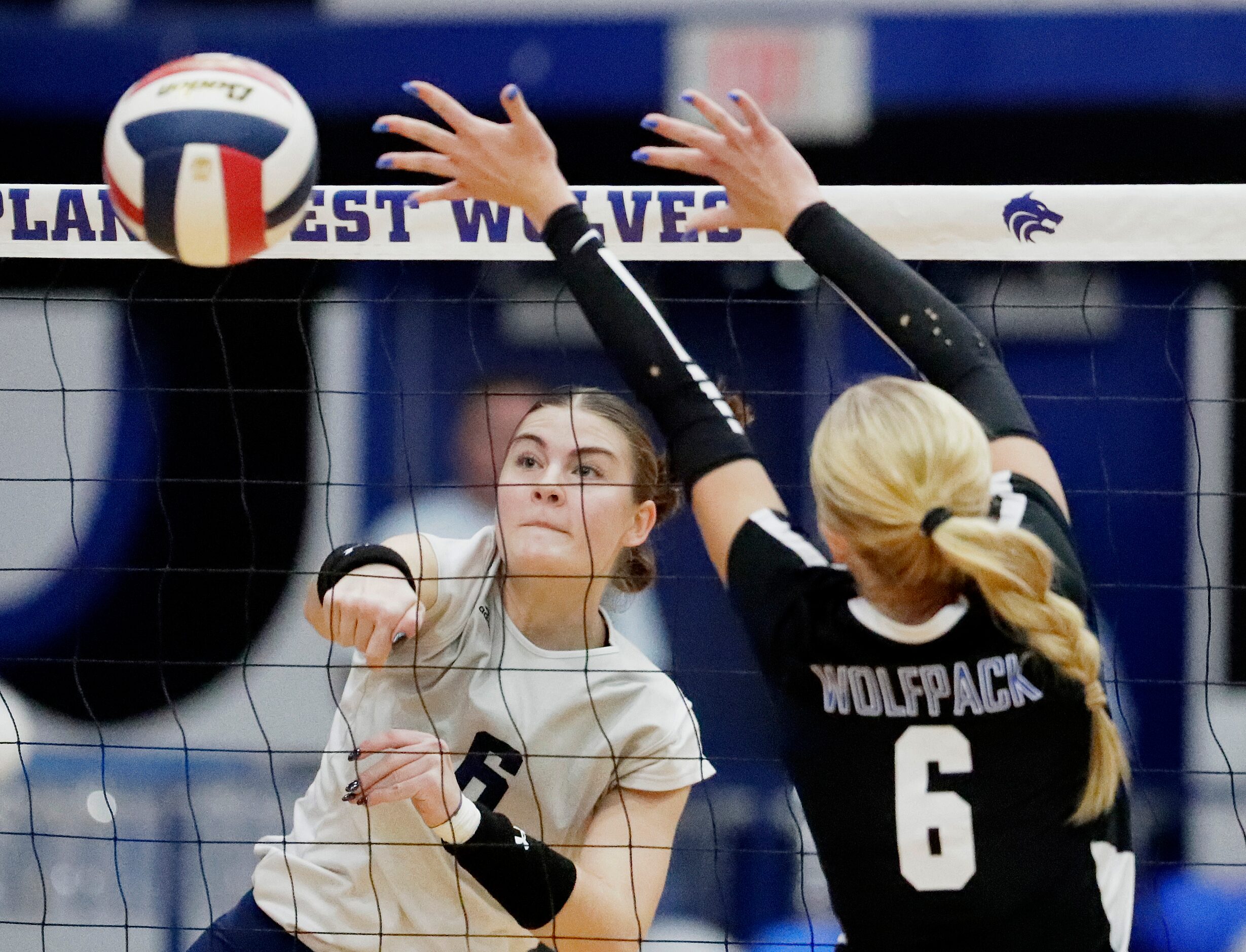 Flower Mound High School middle Liz Goodspeed (6) gets a hit past Plano West High School...