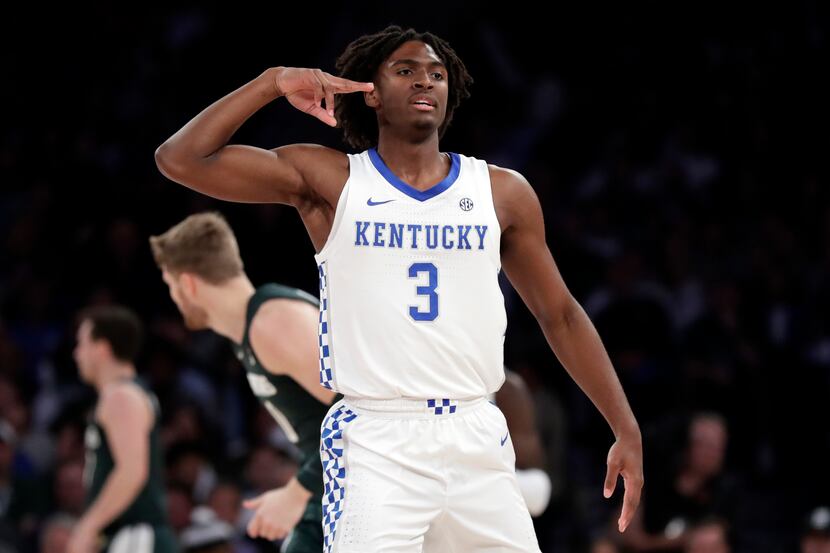 Kentucky guard Tyrese Maxey (3) reacts after making a 3-pointer during the first half of a...