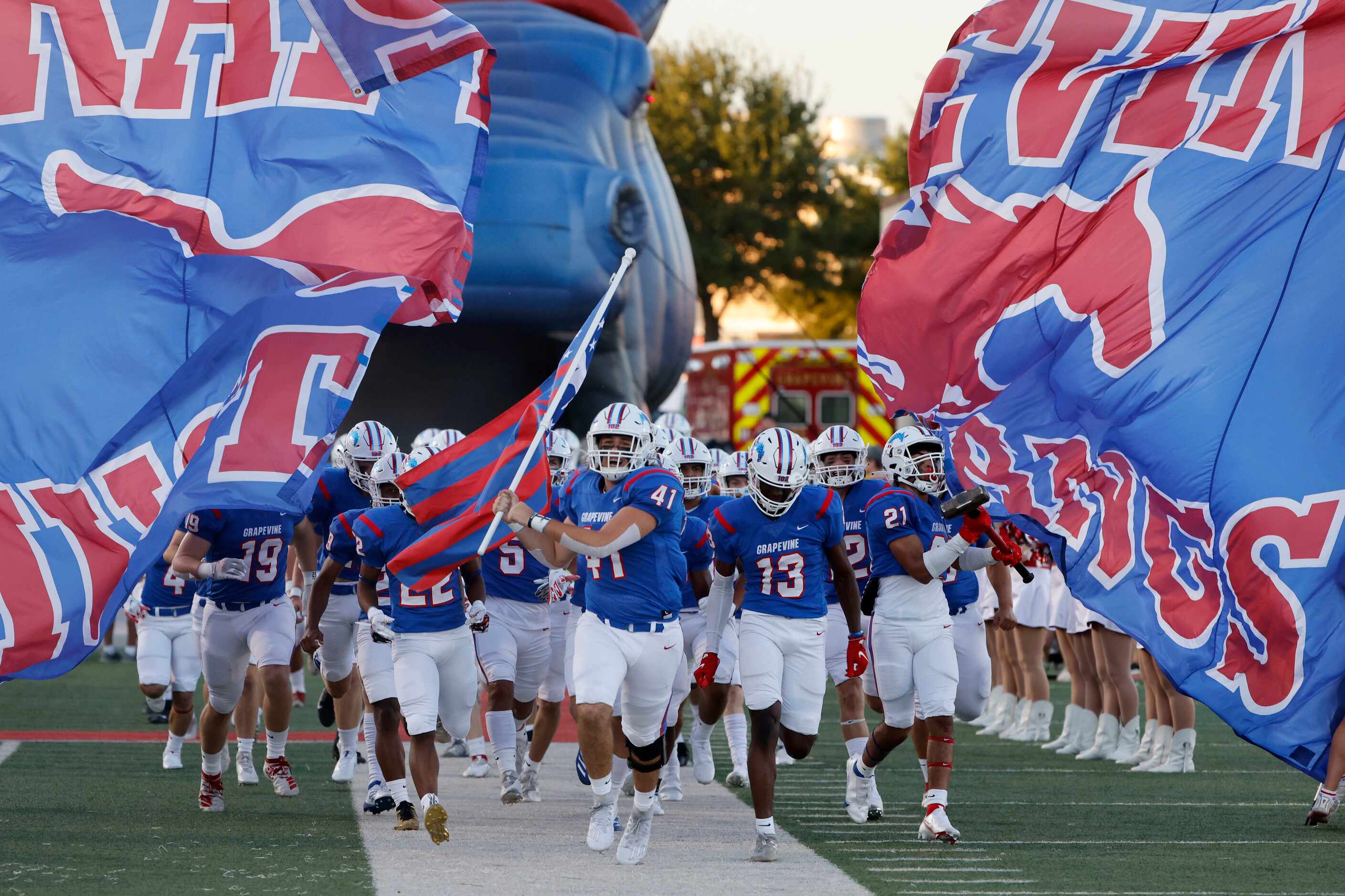 Grapevine players run onto the field prior to playing Colleyville Heritage during the first...