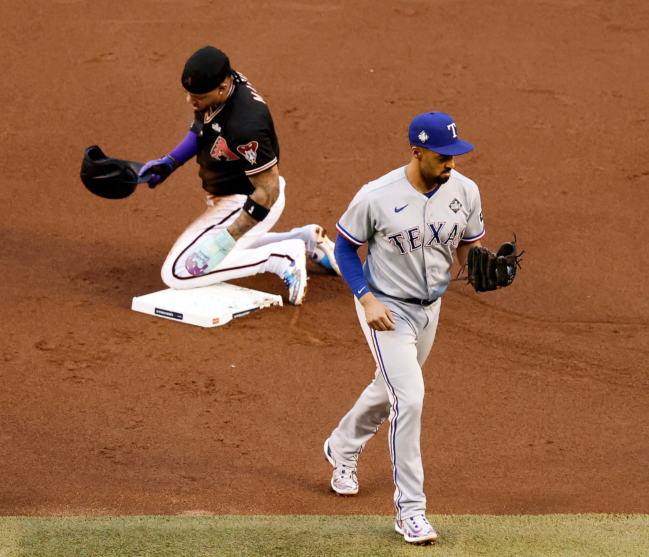 Arizona Diamondbacks’ Ketel Marte (4) is tagged out by Texas Rangers second baseman Marcus...