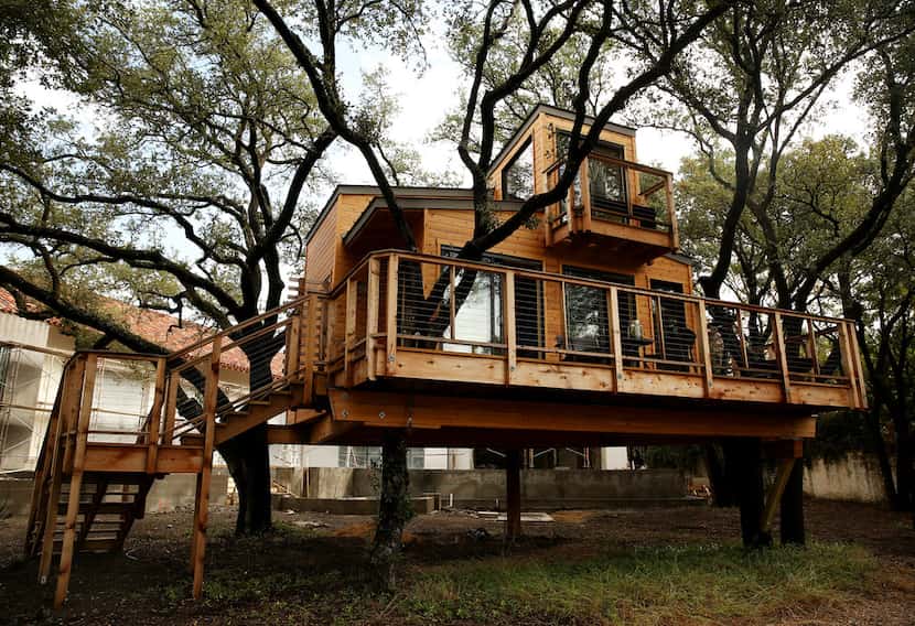 Larissa and her husband KC (last name withheld) built a tree house in their backyard in...