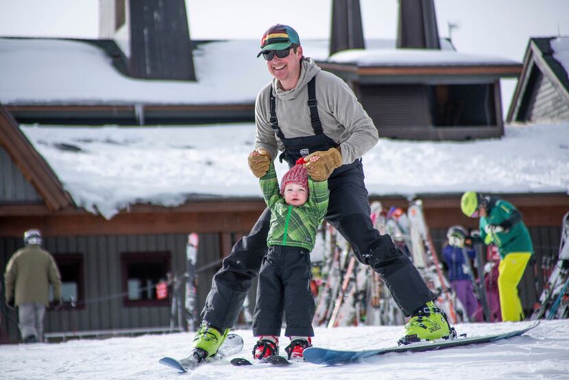 Phillip Supino skis with his son Charles, 2, for his first day in his life on skis on Aspen...