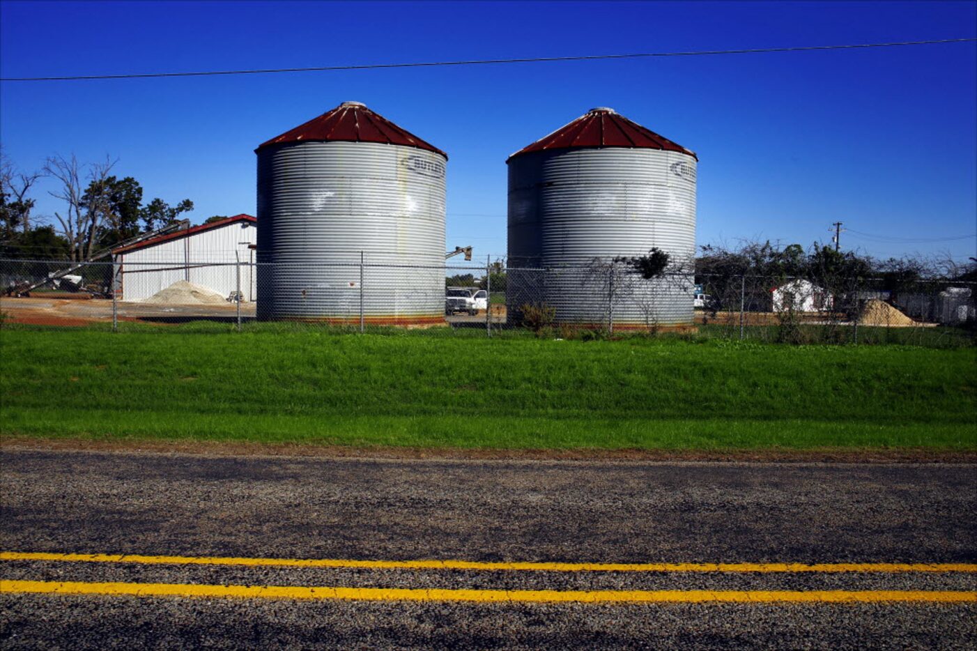 Silos stand on the property of El Dorado Agricultural Products in Athens.