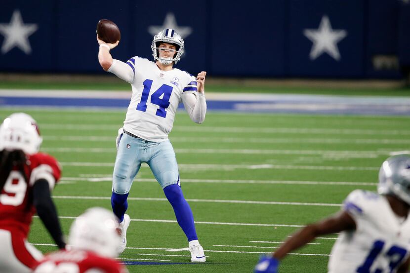 Dallas Cowboys quarterback Andy Dalton (14) attempts a pass in a game against the Arizona...