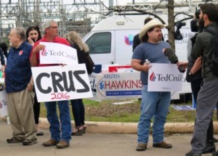  Mark Sacco (left) and William Bruso held signs showing their support for Ted Cruz outside...