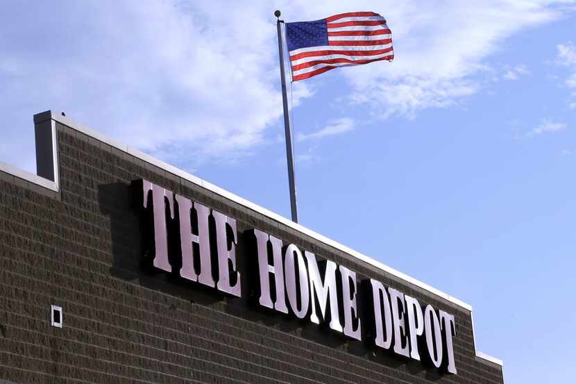 FILE - In this Wednesday, May 18, 2016, file photo, an American flag flies over a Home Depot...