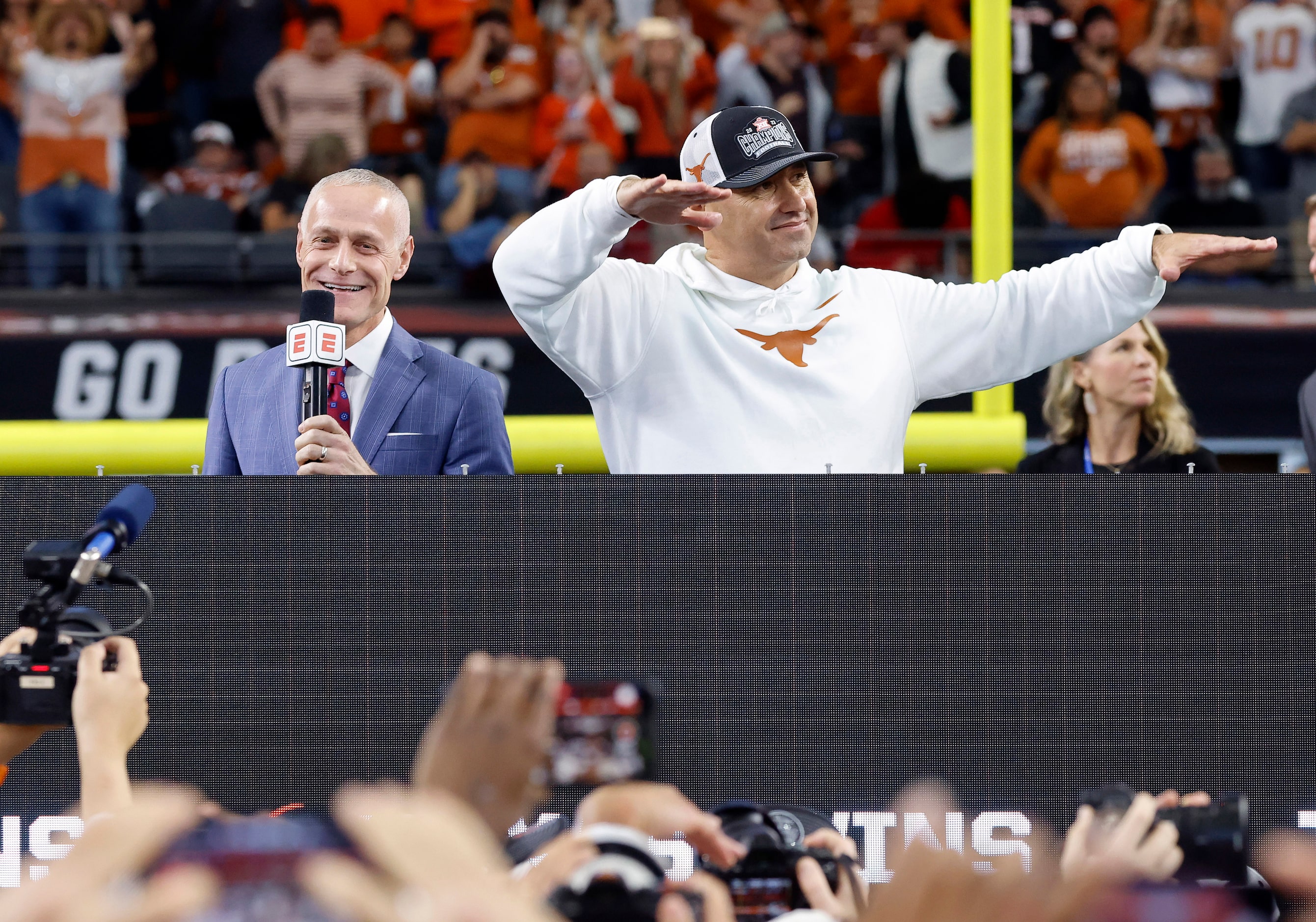 Texas Longhorns head coach Steve Sarkisian (right) tries to quiet the boos by Longhorn fans...