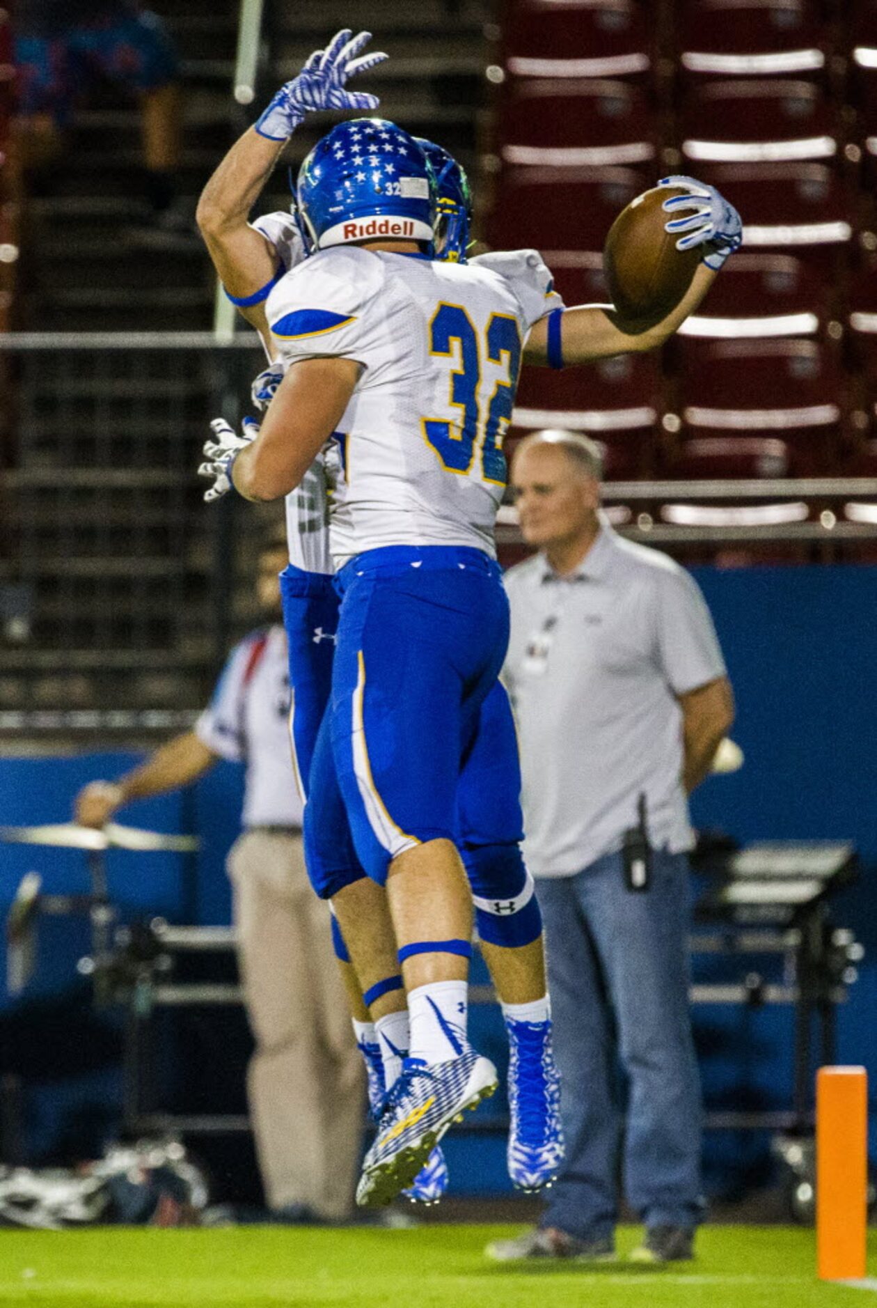 Frisco's Connor Redington (21) celebrates with tight end Austin Candy (32) after Redington...