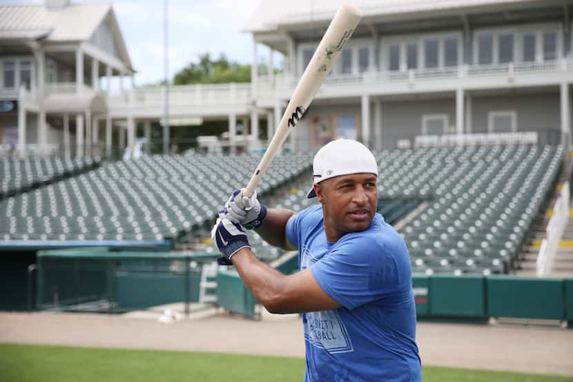 Major League Baseball player Vernon Wells prepares for batting practice during training camp...