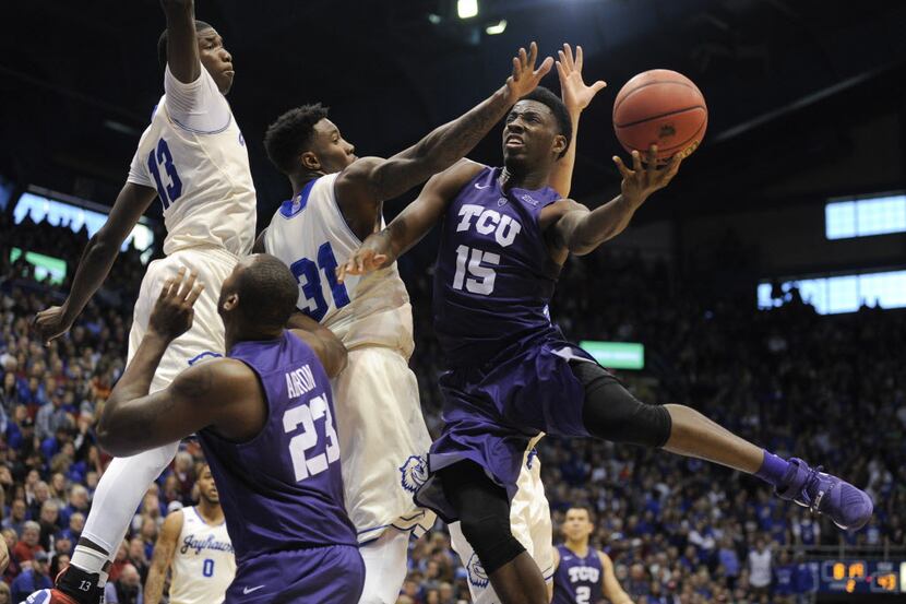 LAWRENCE, KS - JANUARY 16:  JD Miller #15 of the TCU Horned Frogs drives to the basket...