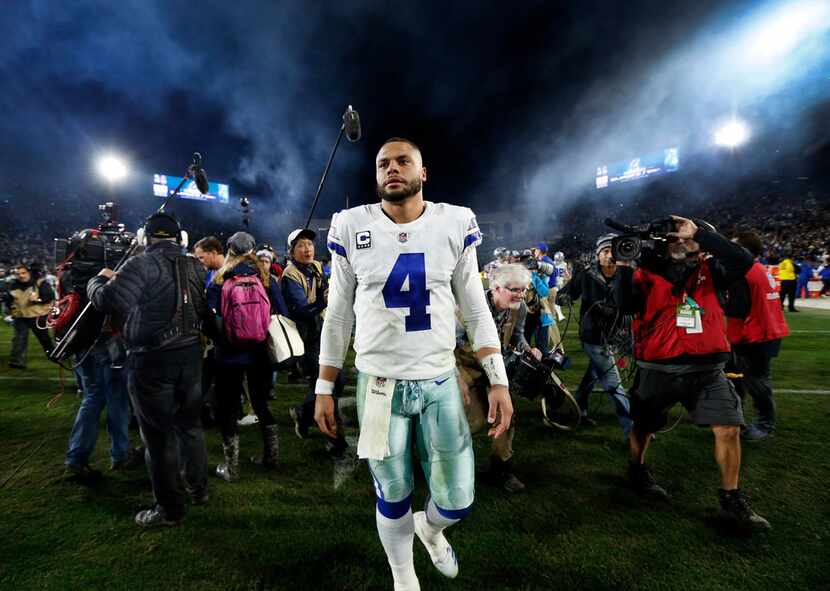 Dallas Cowboys quarterback Dak Prescott (4) walks to the locker room after losing to the Los...