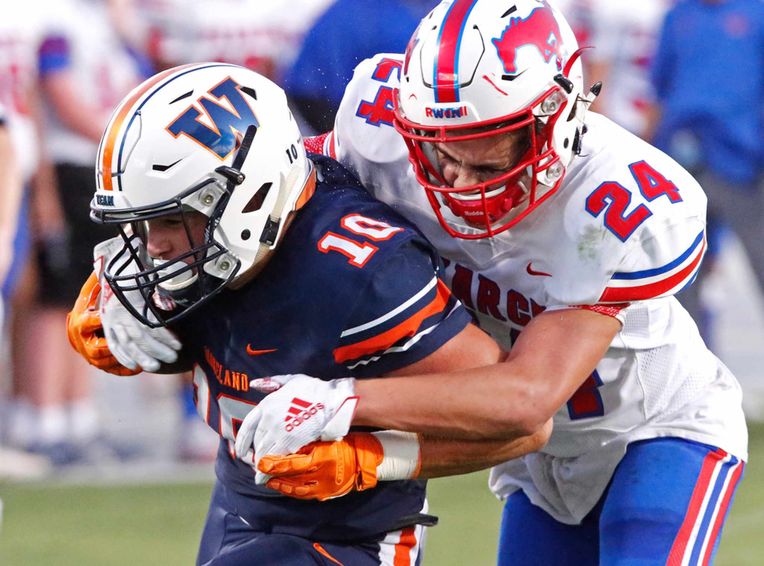 Frisco Wakeland High School wide receiver Peyton Lewis (10) is met by Richardson Pearce High...