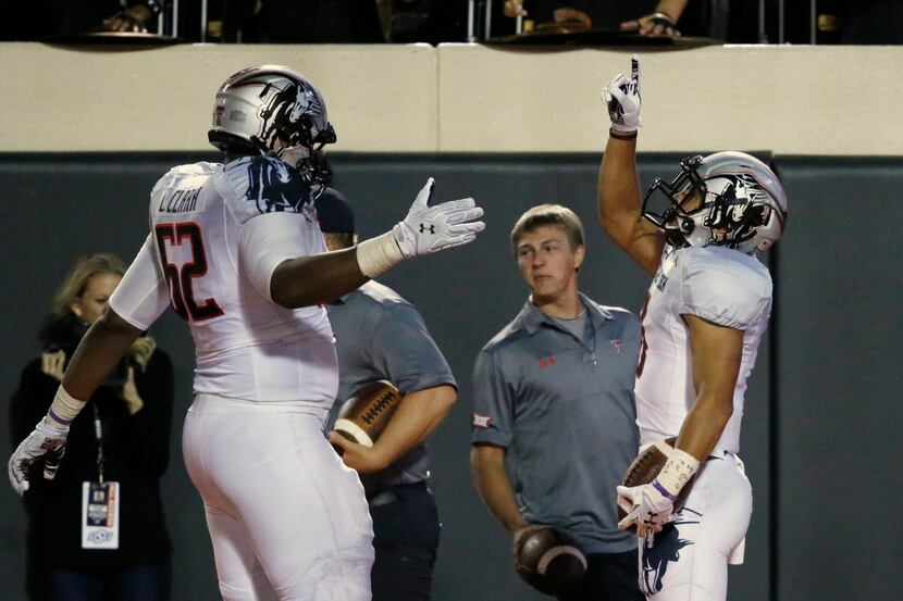 Texas Tech running back Justin Stockton (8) celebrates a touchdown during an NCAA college...
