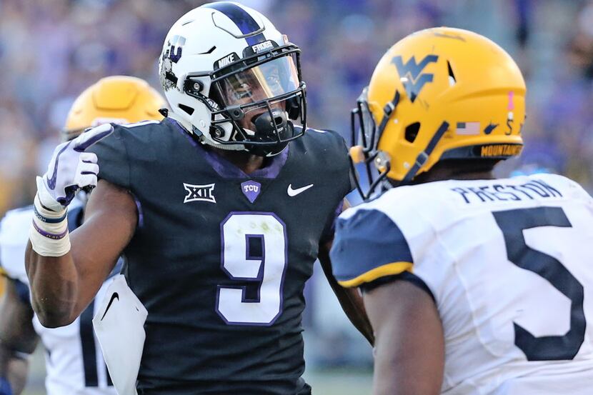 TCU Horned Frogs receiver John Diarse (9) has a few words for West Virginia linebacker...