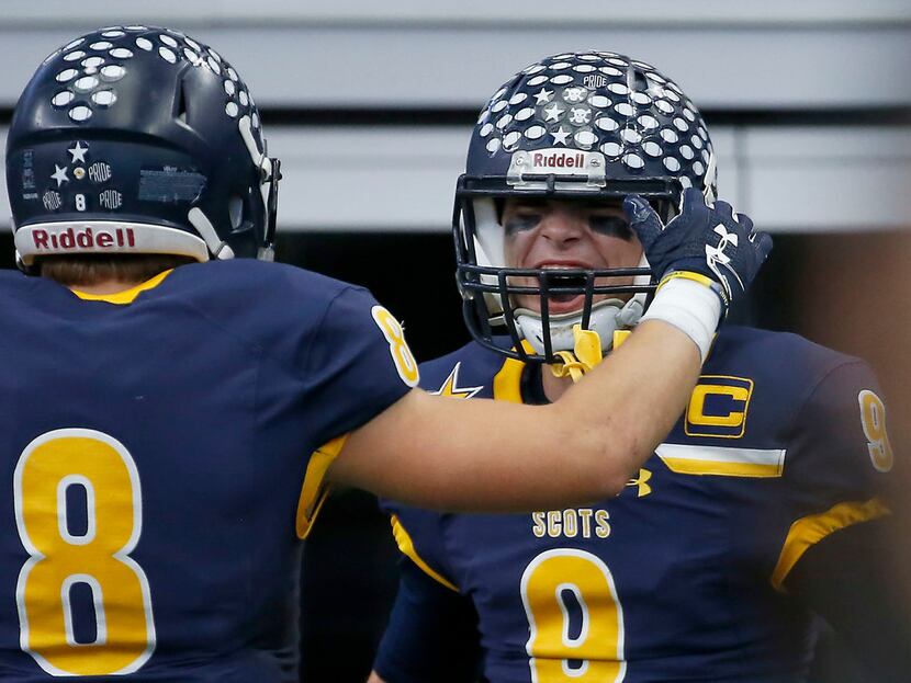 Highland Park quarterback John Stephen Jones (9) celebrates his touchdown with Conner Allen...