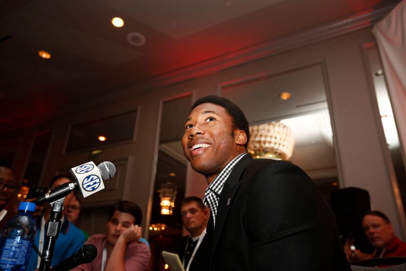 In this 2016 file photo, Texas A&M defensive linebacker Myles Garrett speaks to the media at...