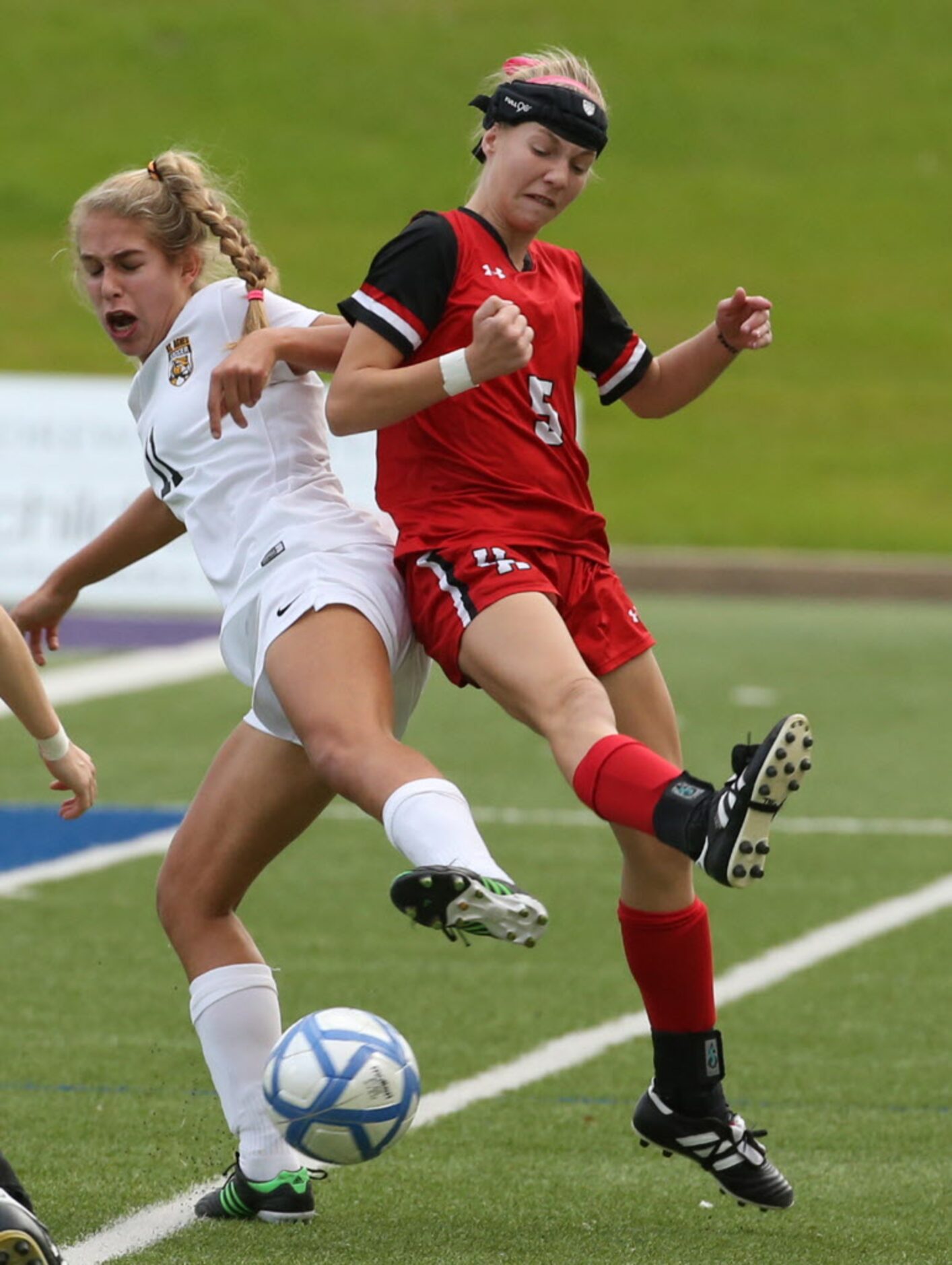 St. Agnes Academys `s11` and Ursuline Academys Lyndsey Hover (5) fight for the ball in the...