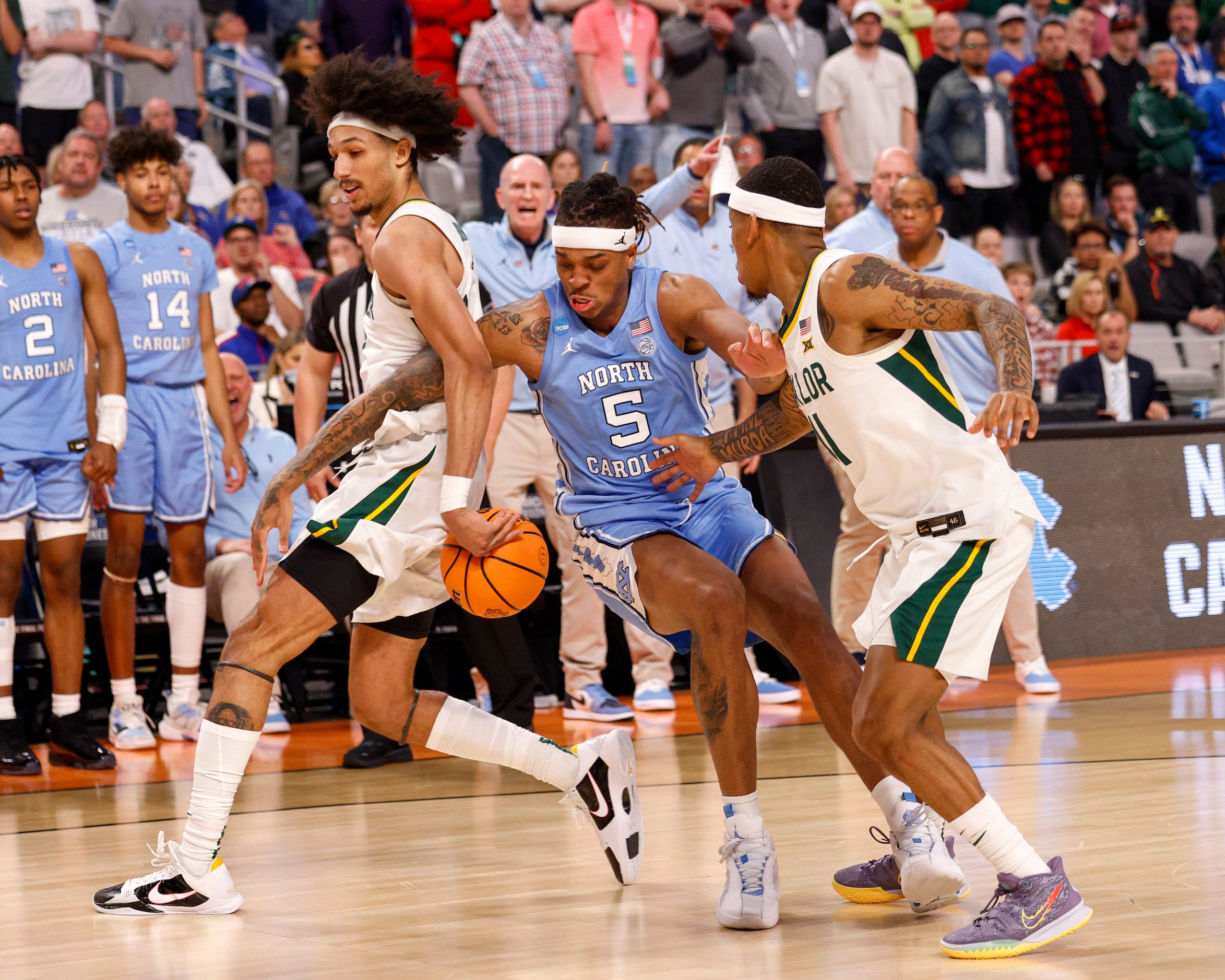 North Carolina Tar Heels forward Armando Bacot (5) falls as he reaches for a rebound...