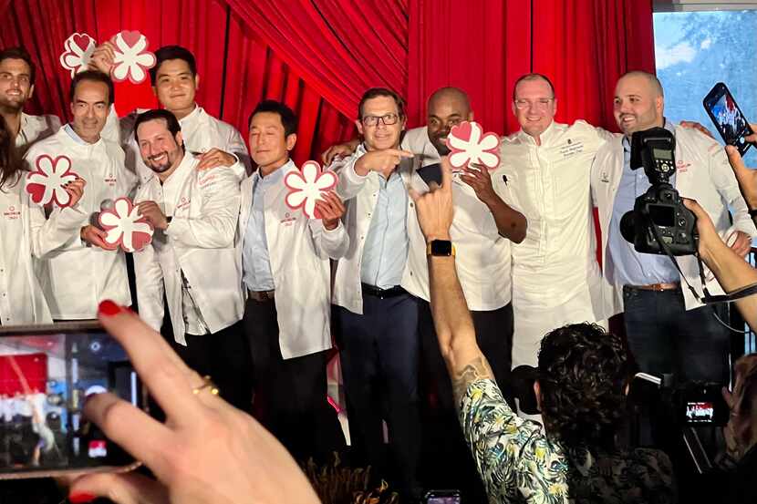 John Tesar, pictured in the middle pointing at the award, is one of the few Dallas chefs who...