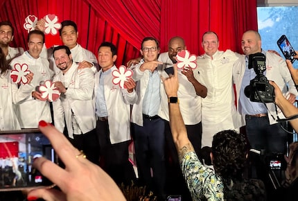 John Tesar, pictured in the middle, received a Michelin star in June 2022 in Orlando for his...