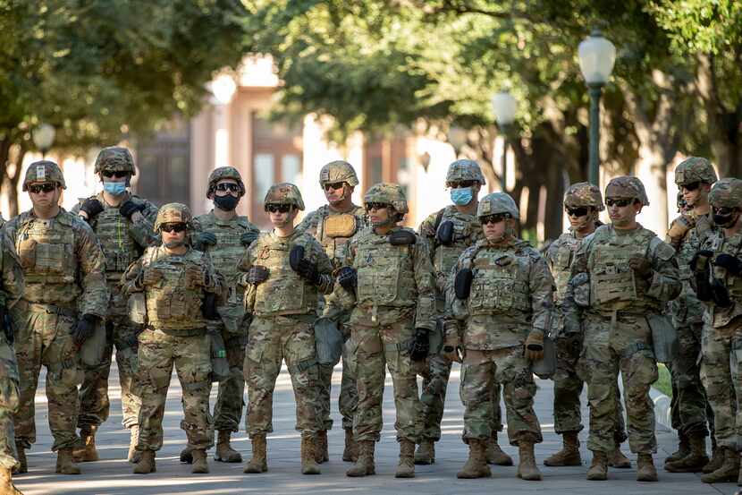 Texas Army National Guard troops are seen assembled at the Texas Capitol building in Austin...