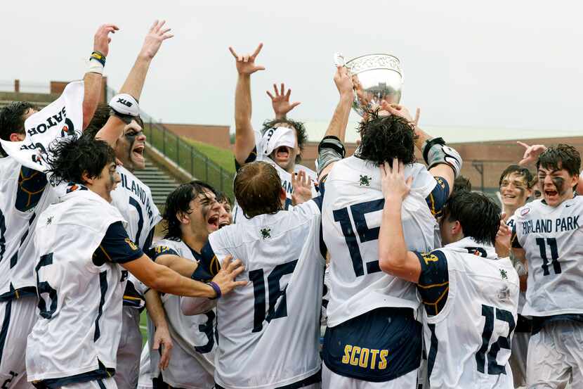 Highland Park players celebrate as they raise the Class AA 2023 Texas High School Lacrosse...