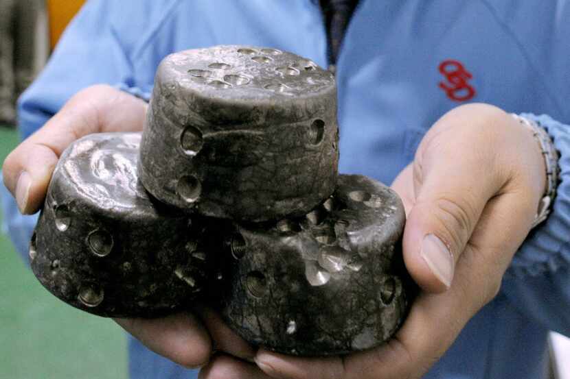 In this undated photo, chunks of chemically processed rare earths are shown in Beijing. 