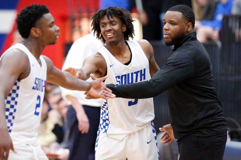 South Garland High School guard Chris Harris Jr (2) is congratulated by South Garland High...