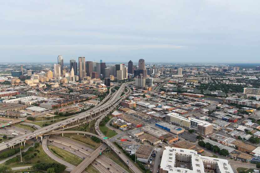 A view looking from south to the north of downtown Dallas. Shown are I-30 (foreground,...