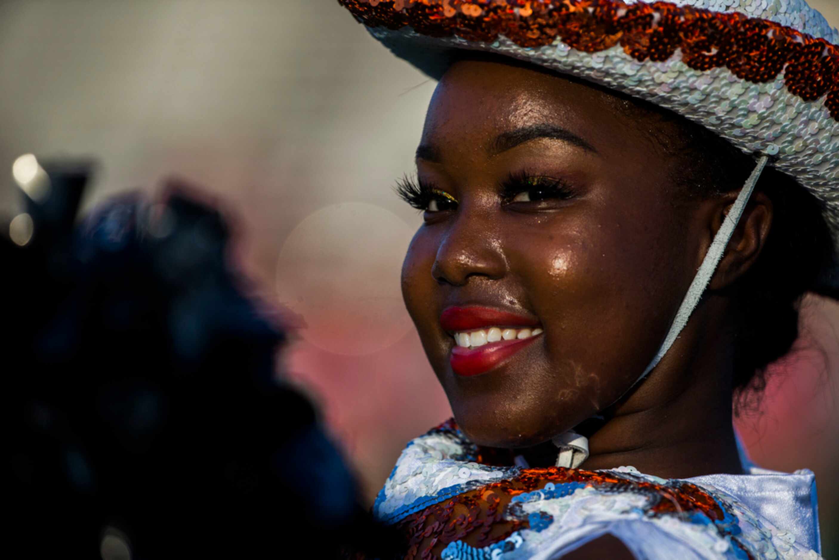 A member of the Arlington Bowie dance team performs before a high school football game...